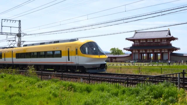 A Kintetsu limited express train passing the Suzaku Gate of the former Heijo Palace, Nara